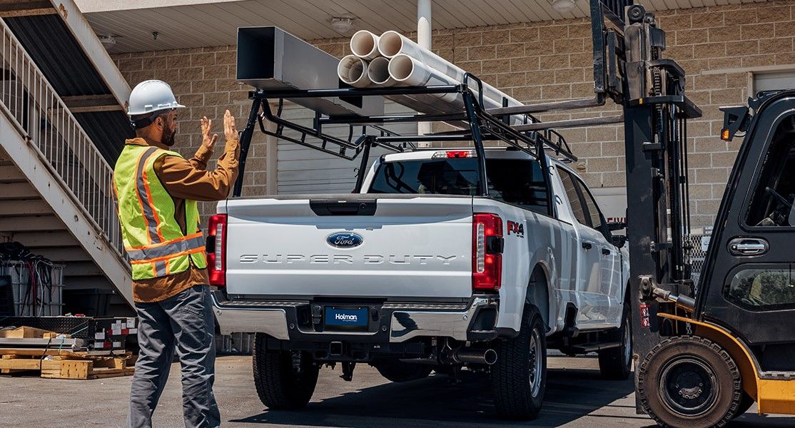 commerical contractor truck with forklift loadable ladder and conduit rack