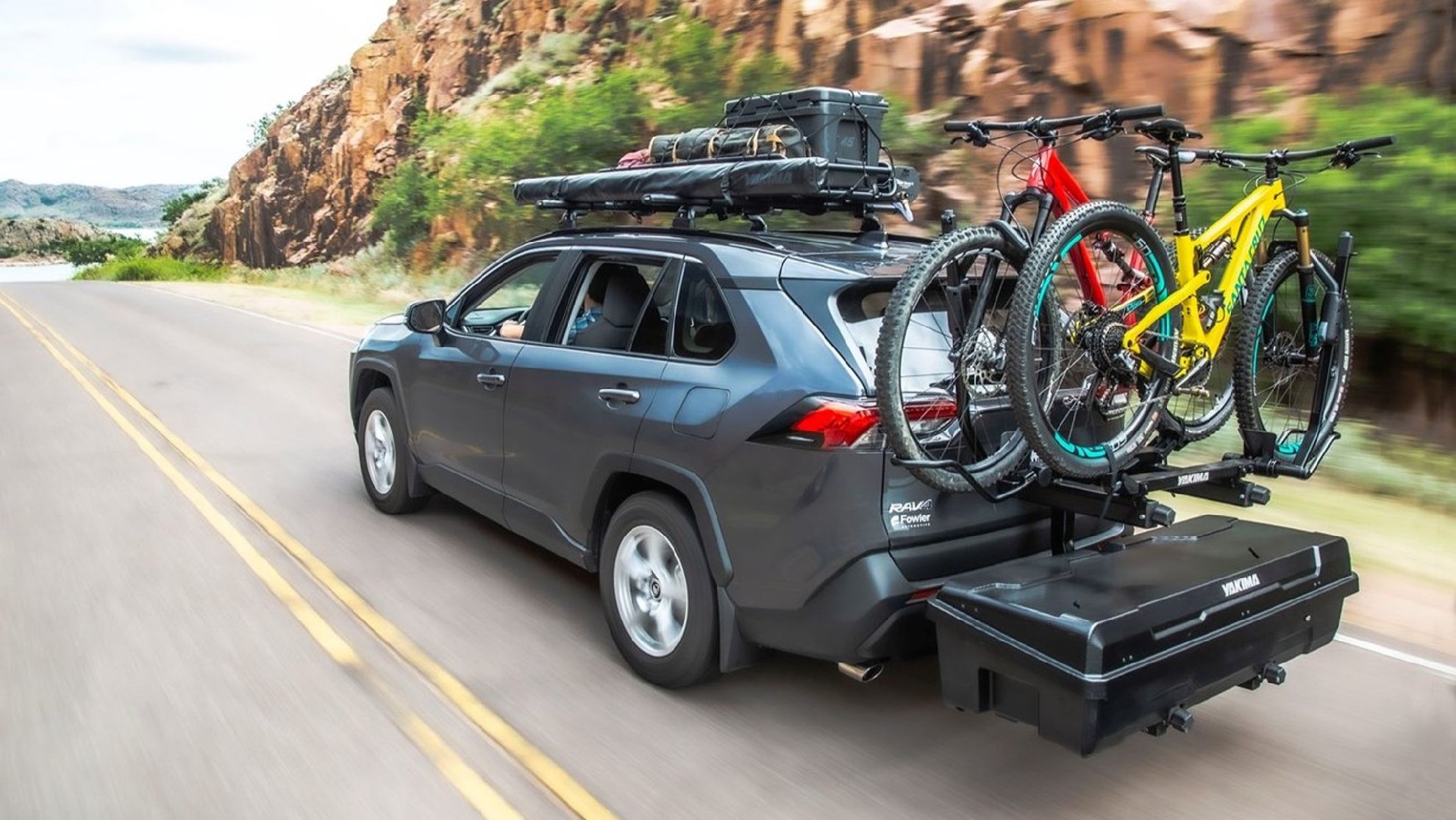 Hitch mounted cargo system loaded up with bikes on an SUV