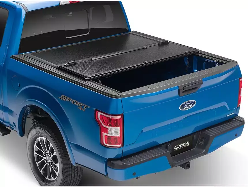 A pickup truck with a hard folding bed cover