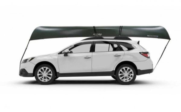 a car with a canoe on a roof rack